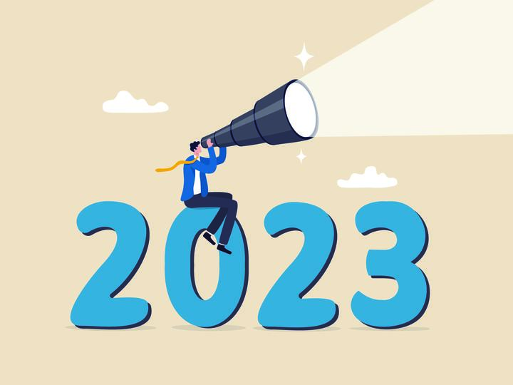 Illustration of a person with a telescope sitting on top of 2023