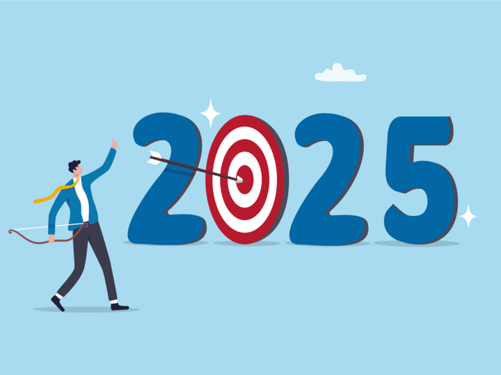 Person with a bow and arrow celebrating hitting the bullseye of 2025