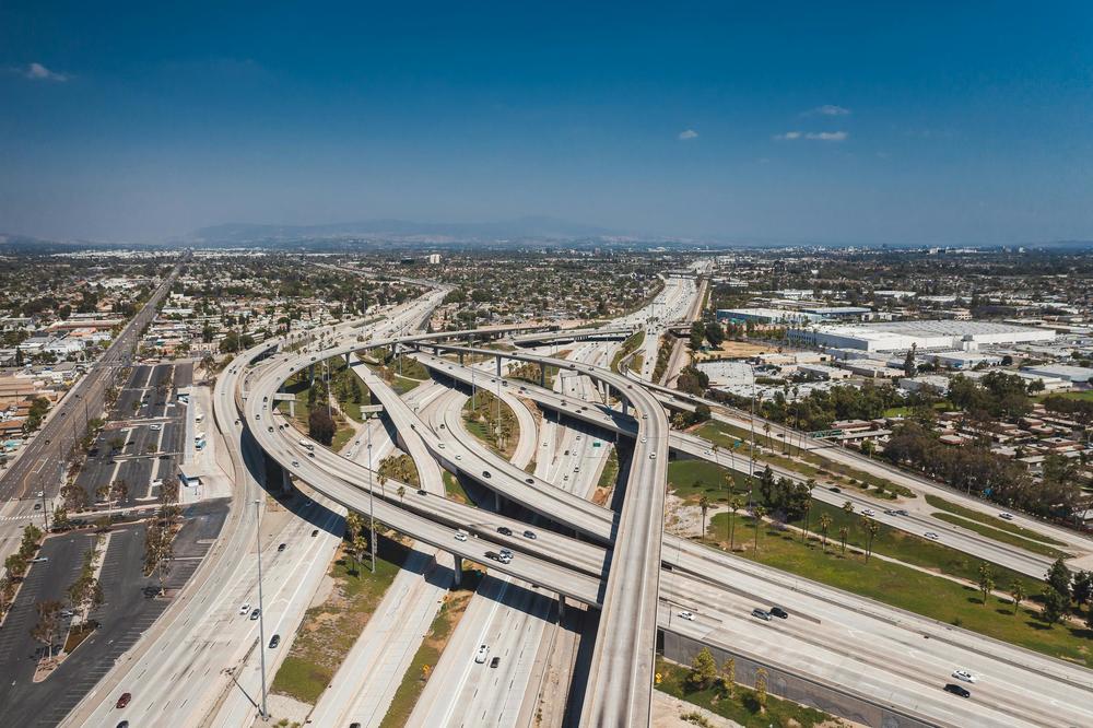 An overhead shot of an intricate arrangement of freeway overpasses.