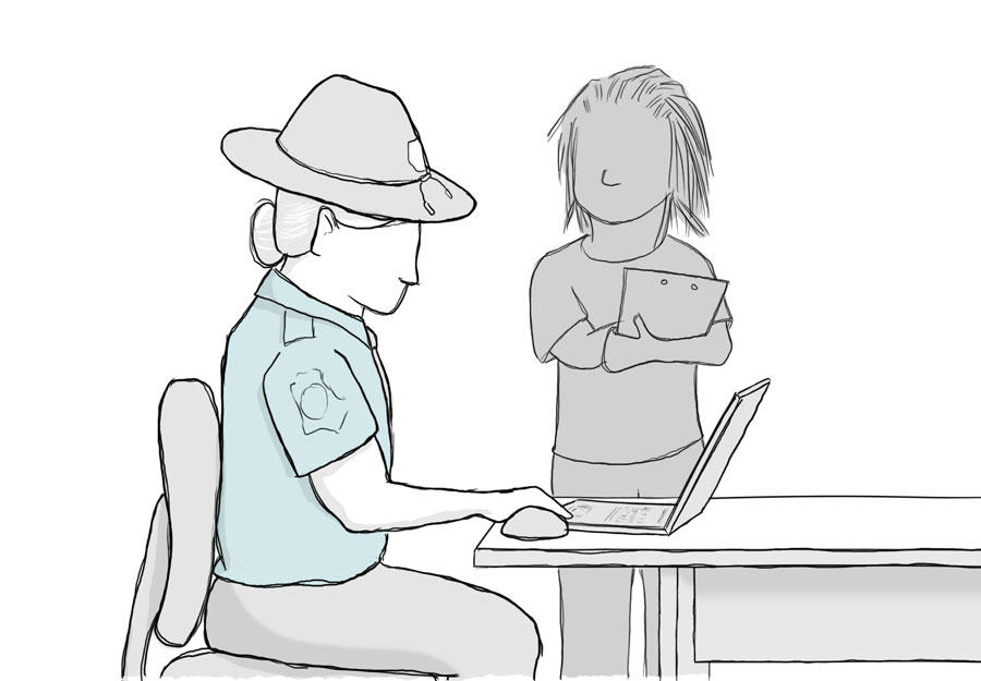 A person with a clipboard watching a police officer use a website.